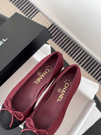 Chanel ballet flats in shoe box: burgundy uppers with black toe cap and pink bow