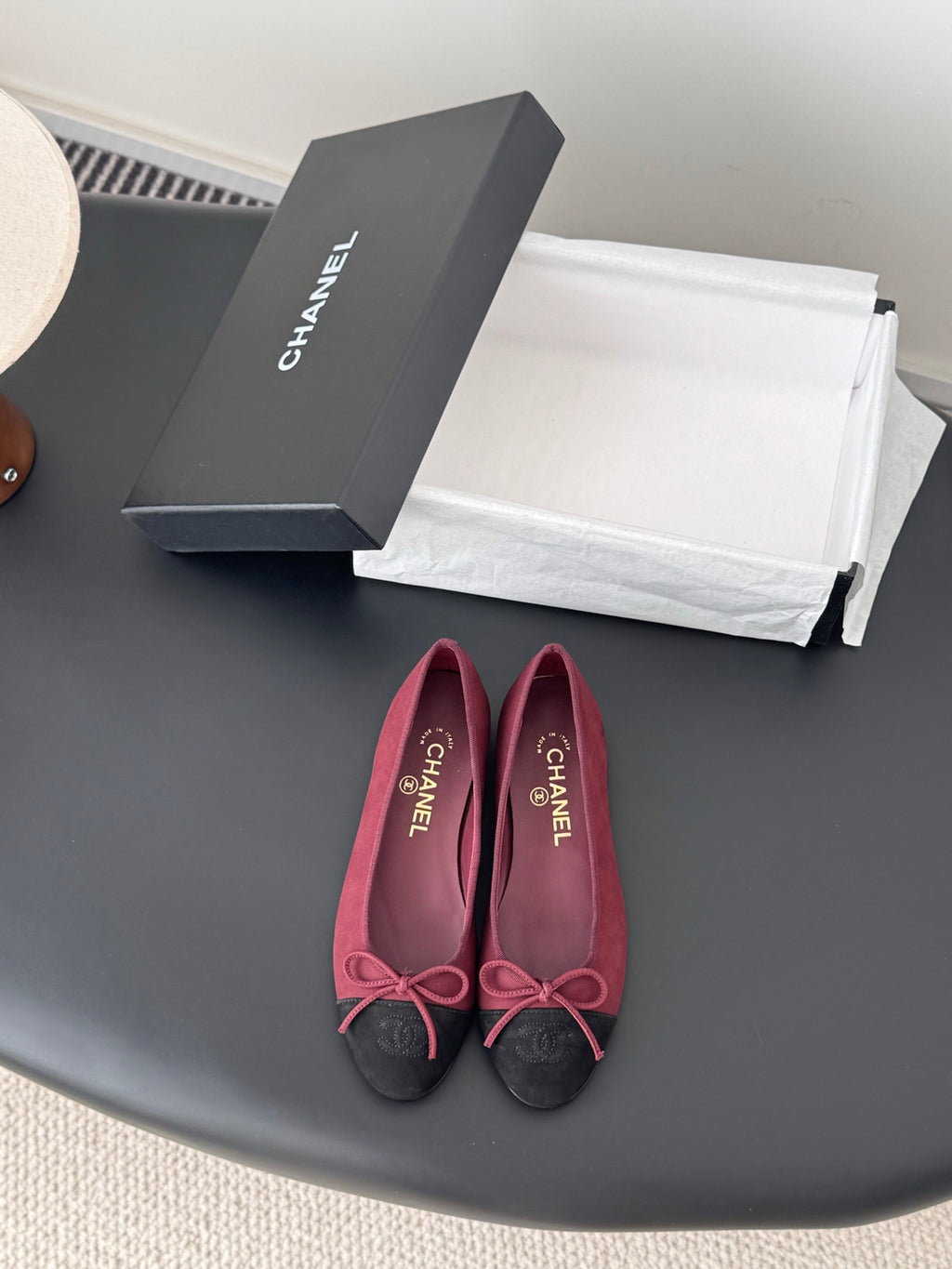 Chanel ladies ballet flats with burgundy fabric and black toe cap, pink bow detail