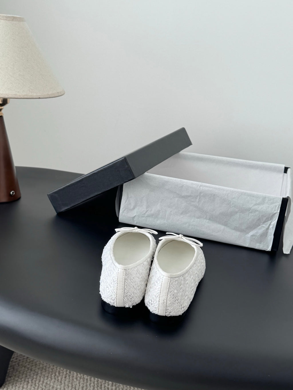 Two-tone ballet flats in a pair, white textured uppers with bow-tied laces
