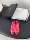 Pink Chanel ballet flats with bow at toe, embossed CC logo