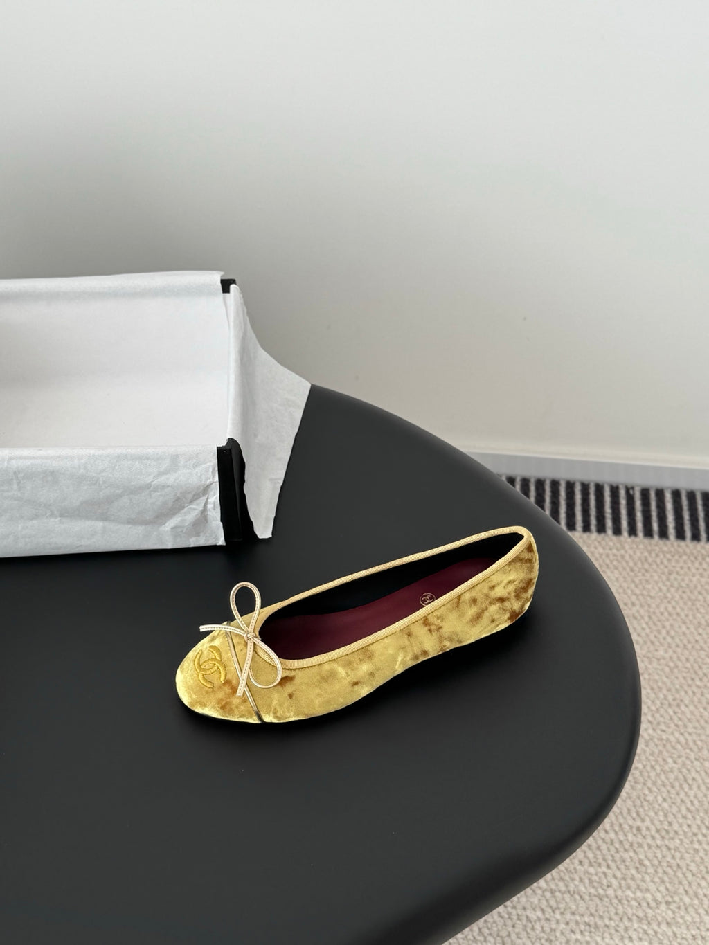 Women's gold ballet flat with ribbon bow, round toe and purple CHANEL insole