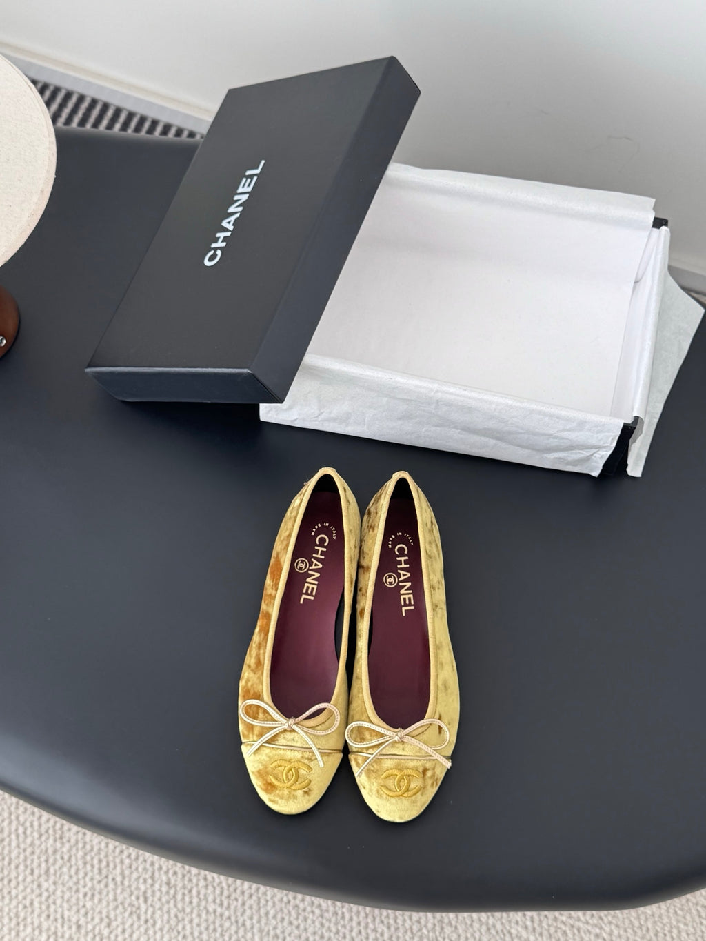 Women's gold ballet flats with ribbon bow at instep and round toe