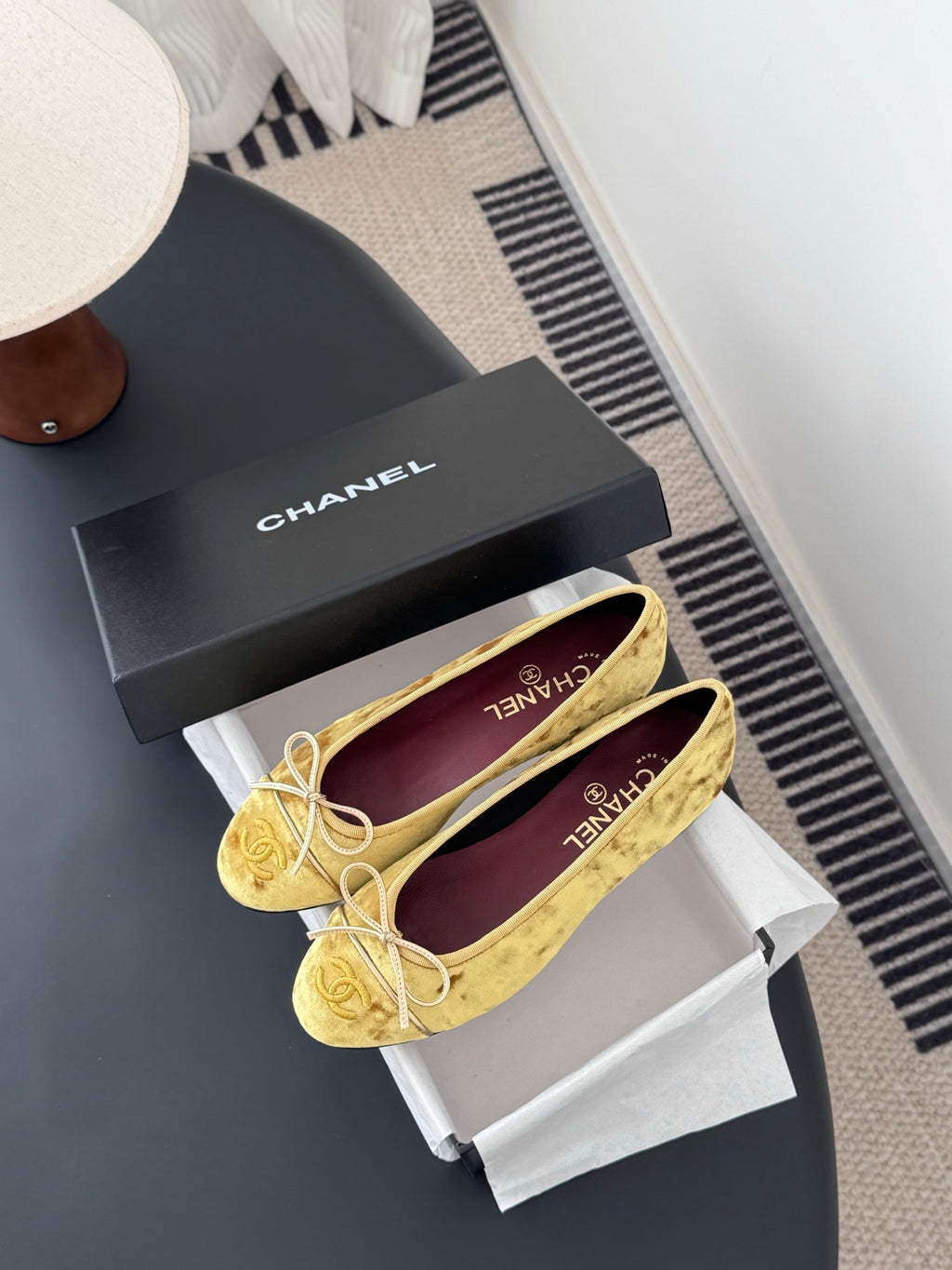 Women's gold ballet flats with ribbon bow and round toe, purple logo insole