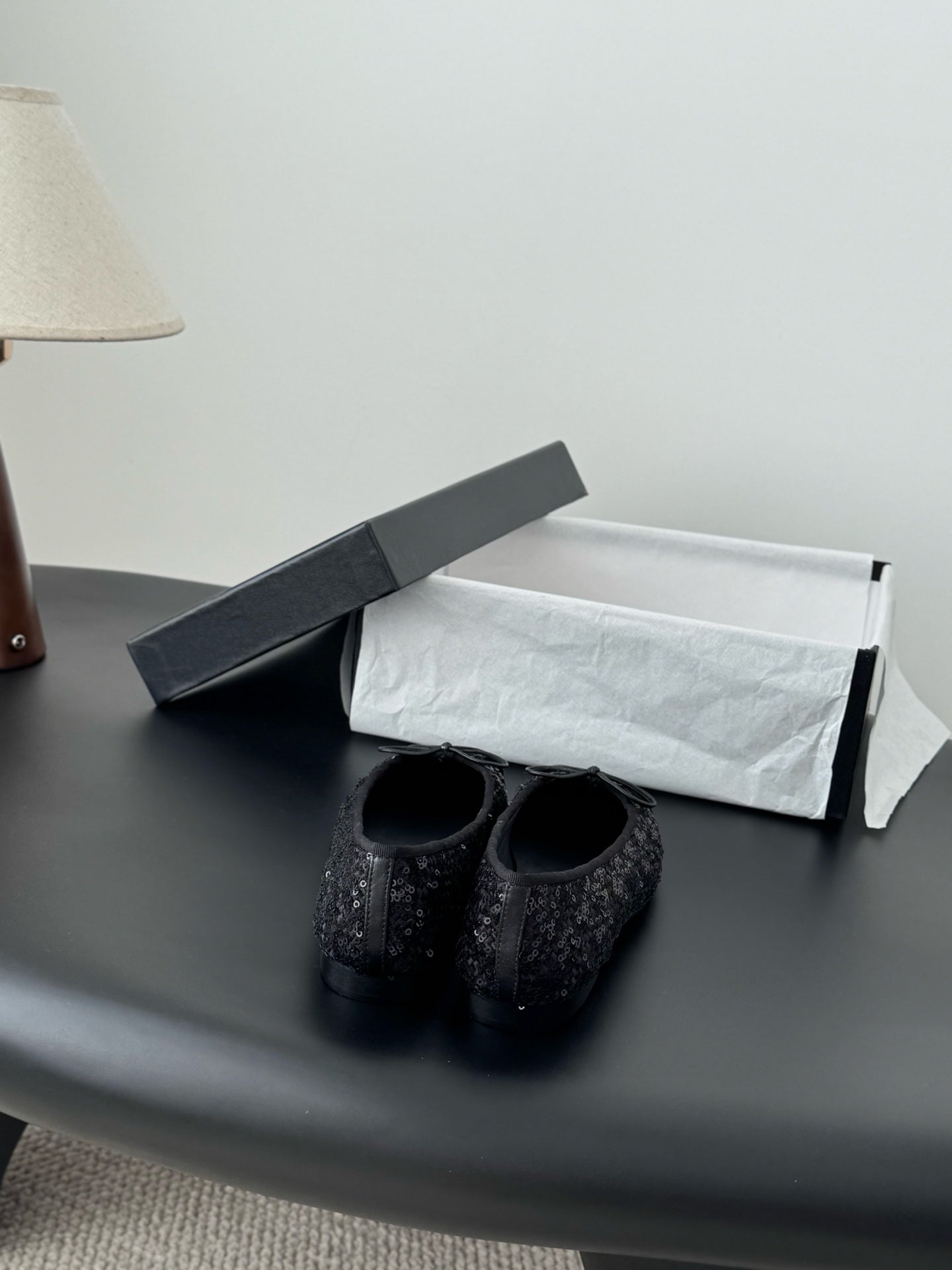Chanel ladies dark glitter ballet flats, front view with bow ties and round toe