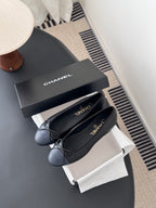 Pair of dark ballet flats with ribbon bow, CHANEL logo on insoles