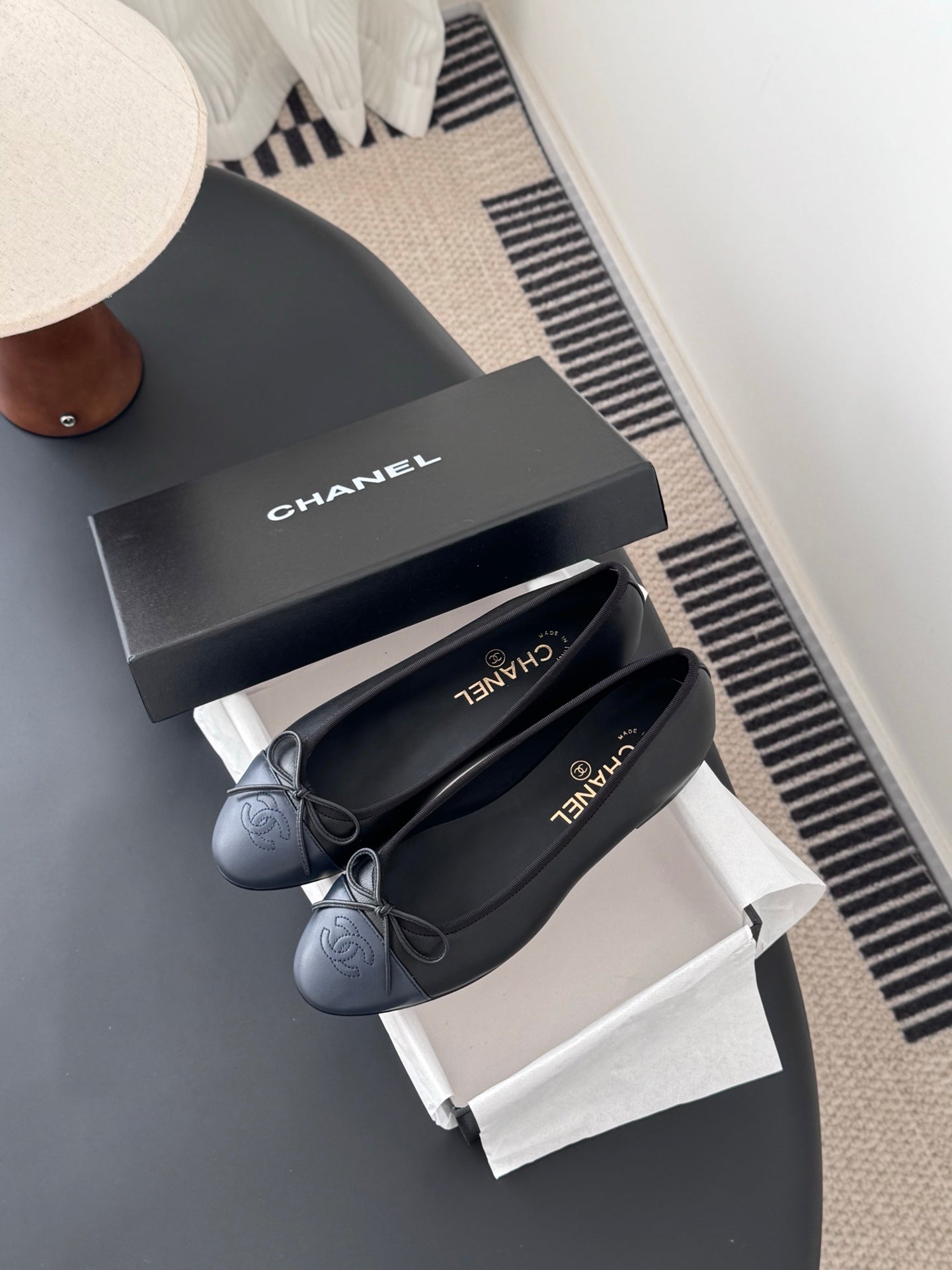 Pair of dark ballet flats with ribbon bow, CHANEL logo on insoles