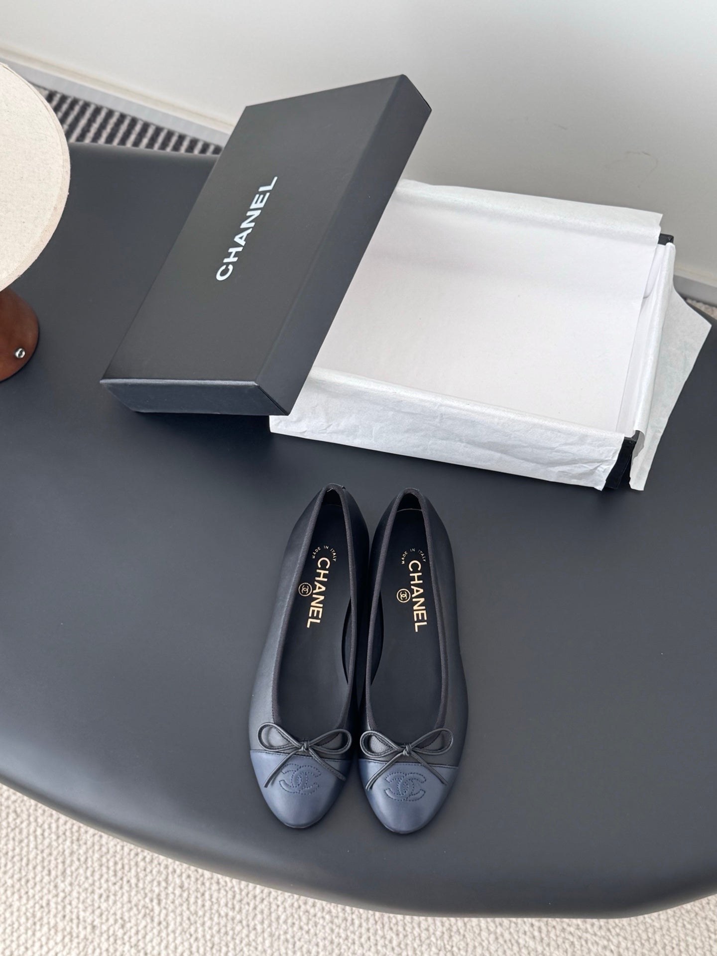 Pair of CHANEL dark blue ballet flats with ribbon bow and round toe