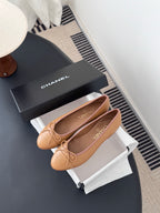 Tan Chanel ballet flats with bow and embossed logo, with gift box
