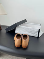 Tan Chanel ballet flats with bow detail, rear view