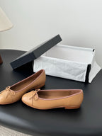 Tan Chanel ballet flats with bow at vamp, round toe