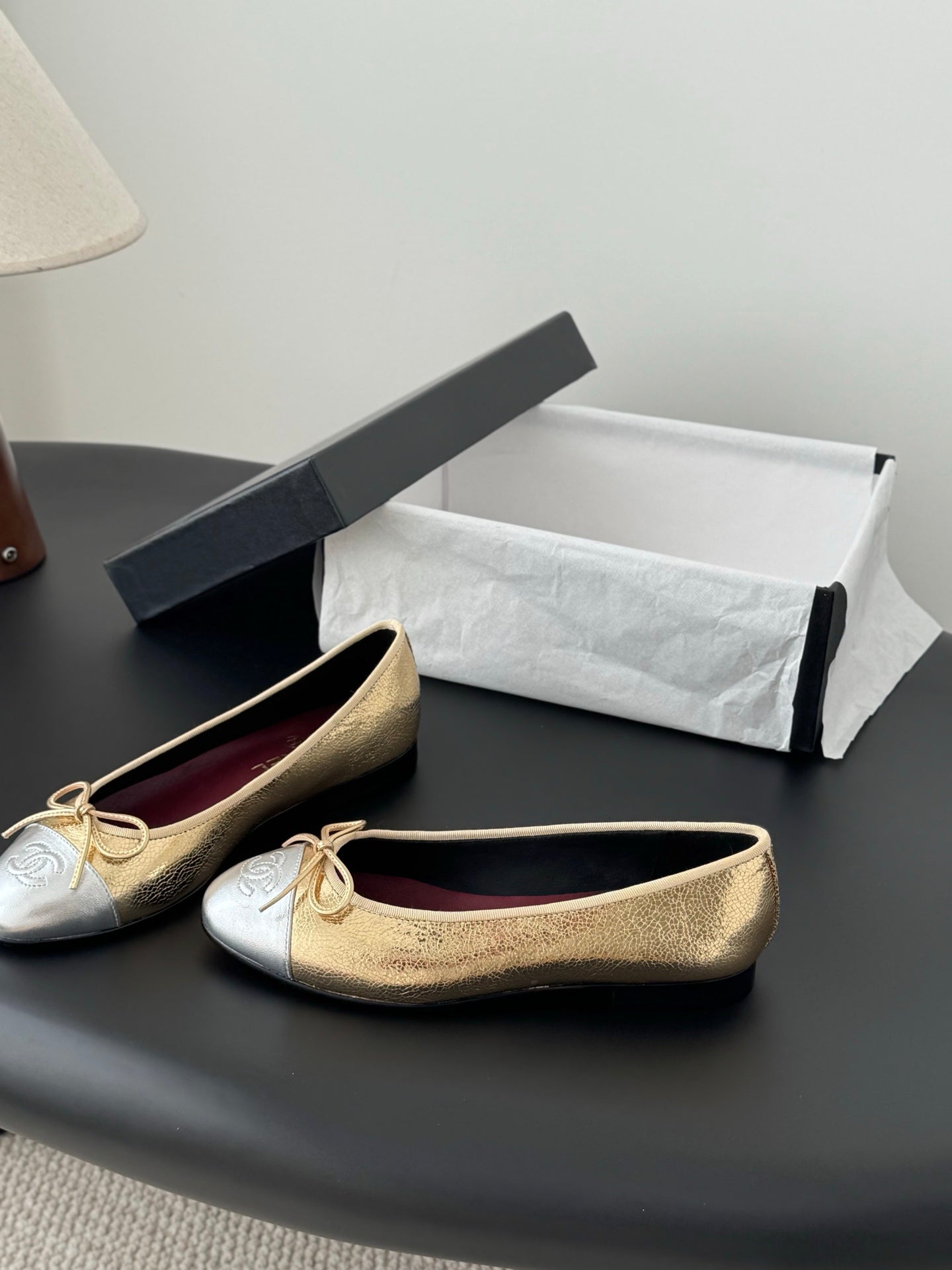 Two-tone gold and cream ballet flats with bow laces and round toe