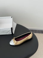 Single gold-and-cream ballet flat with bow laces and round toe