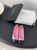 Chanel pink and black ballet flats with bow, quilted trim, and round toe