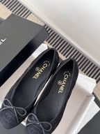 Women's dark Chanel flats with lace-up bows, round toe