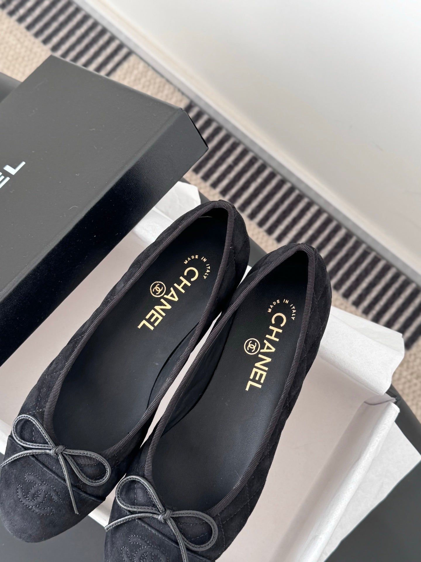 Women's dark Chanel flats with lace-up bows, round toe