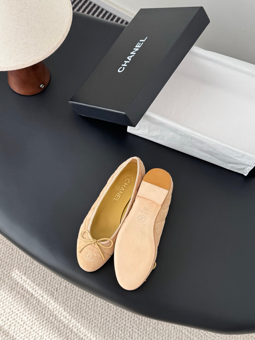 Beige quilted ballet flats with ribbon bow, round toe, front and side view
