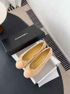 Beige quilted ballet flats with bow at toe, round toe, pair on display with box