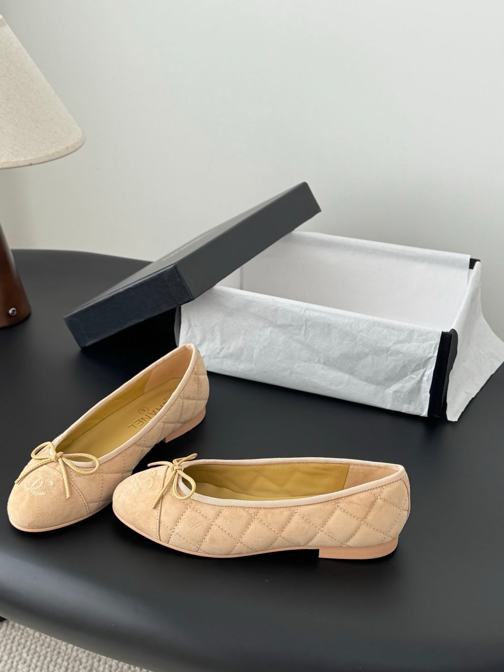 Beige quilted ballet flats with lace-up bow, round toe, open top view