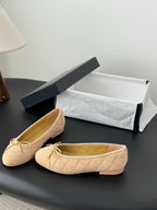 Beige quilted ballet flats with lace-up bow, round toe, open top view