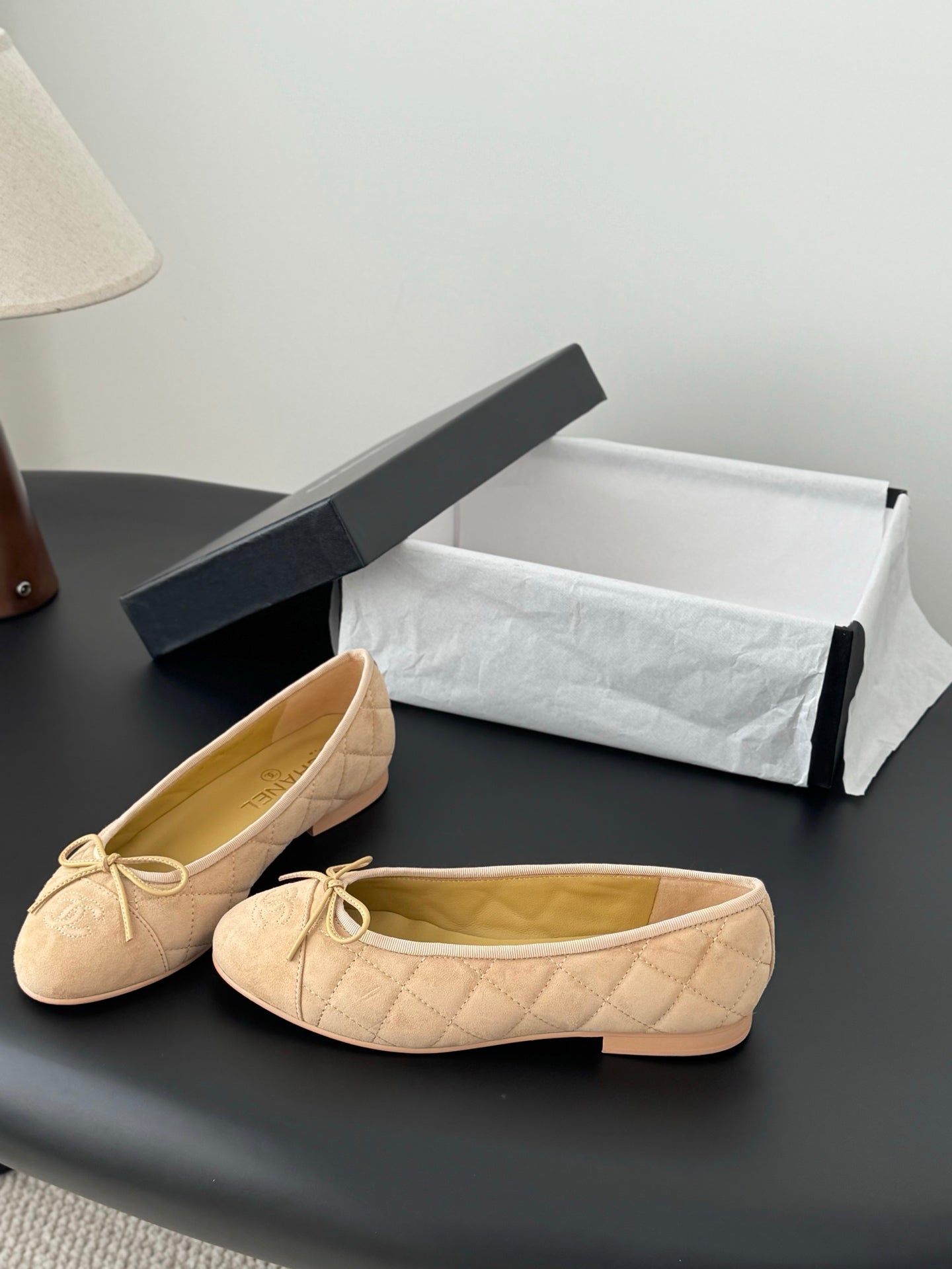 Beige quilted ballet flats with lace-up bow, round toe, open top view