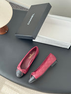 Pink and black quilted ballet flats with bow detail and rounded toe