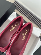 Pink quilted ballet flats with CHANEL logo insole and bow laces