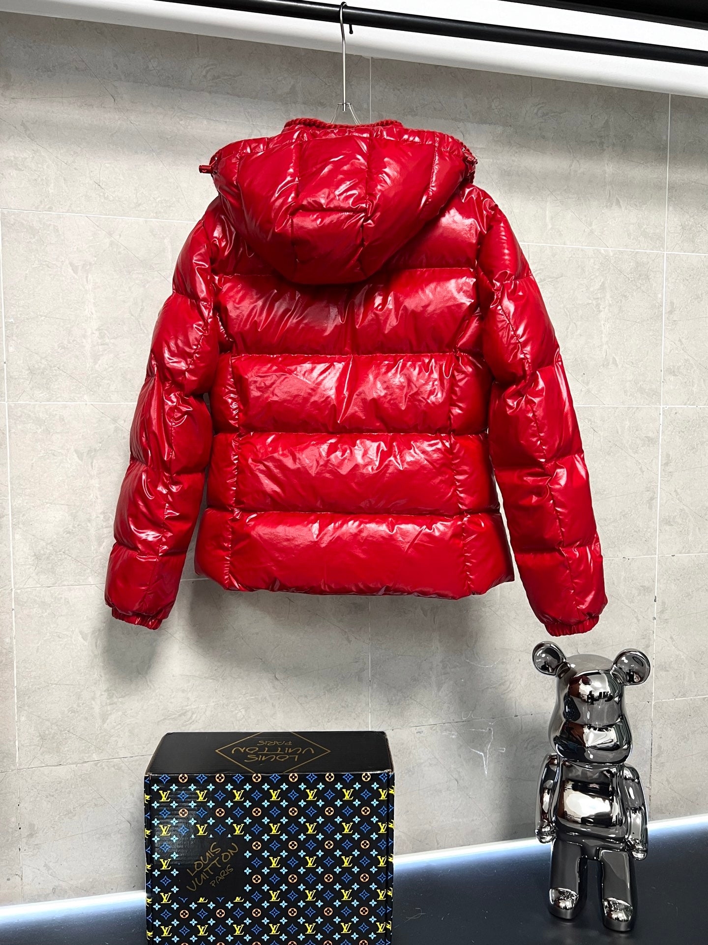 Moncler long red puffer jacket with back hood, quilted puffer construction and zipper