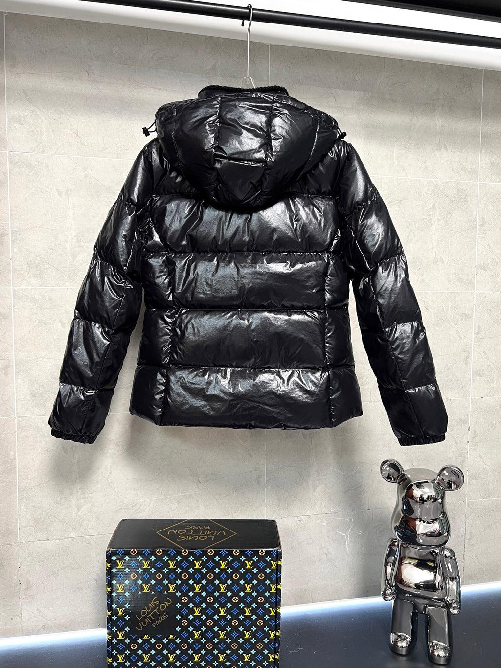 Moncler long puffer jacket, glossy black with raised hood and horizontal quilting