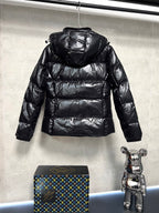 Moncler long puffer jacket, glossy black with raised hood and horizontal quilting