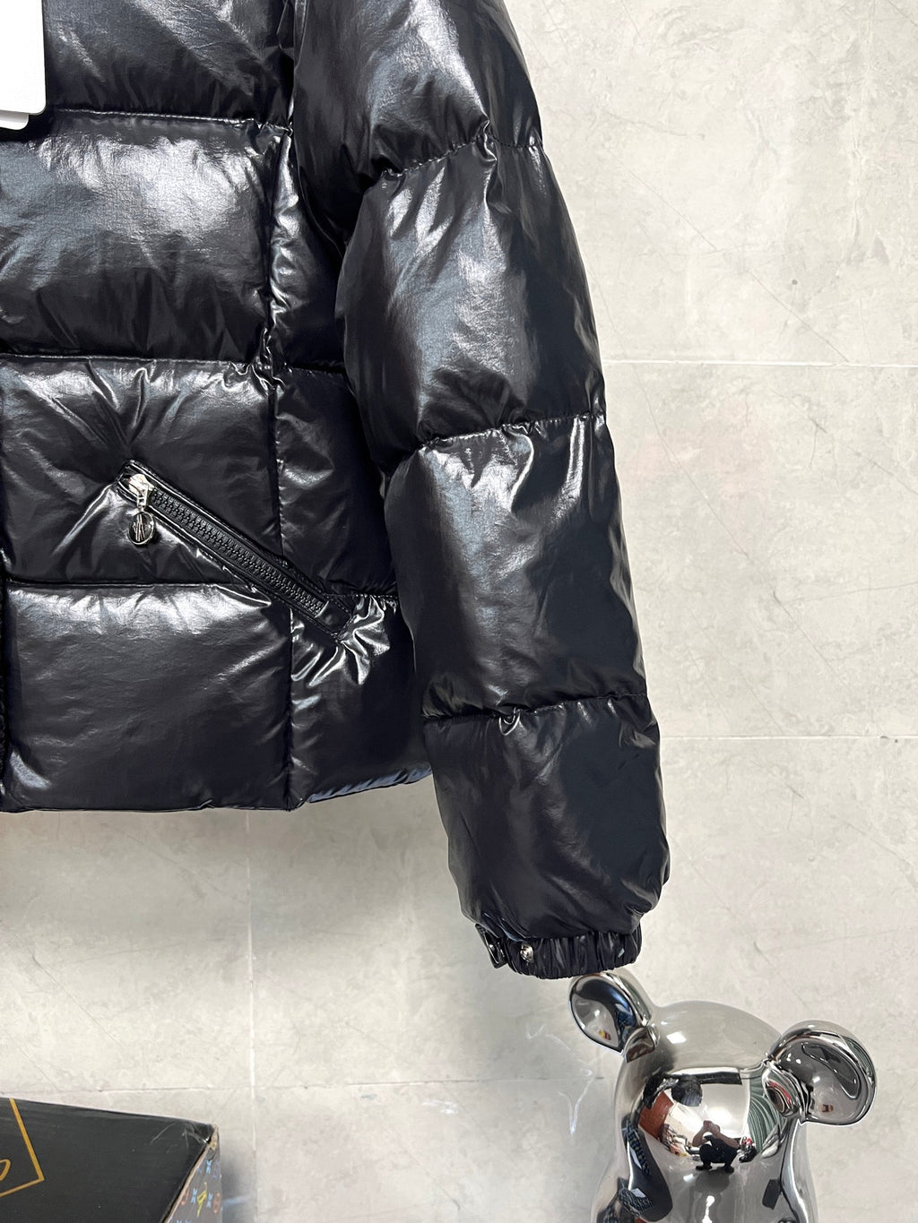 Moncler long puffer jacket sleeve, glossy black quilting with elastic cuff and zip pocket