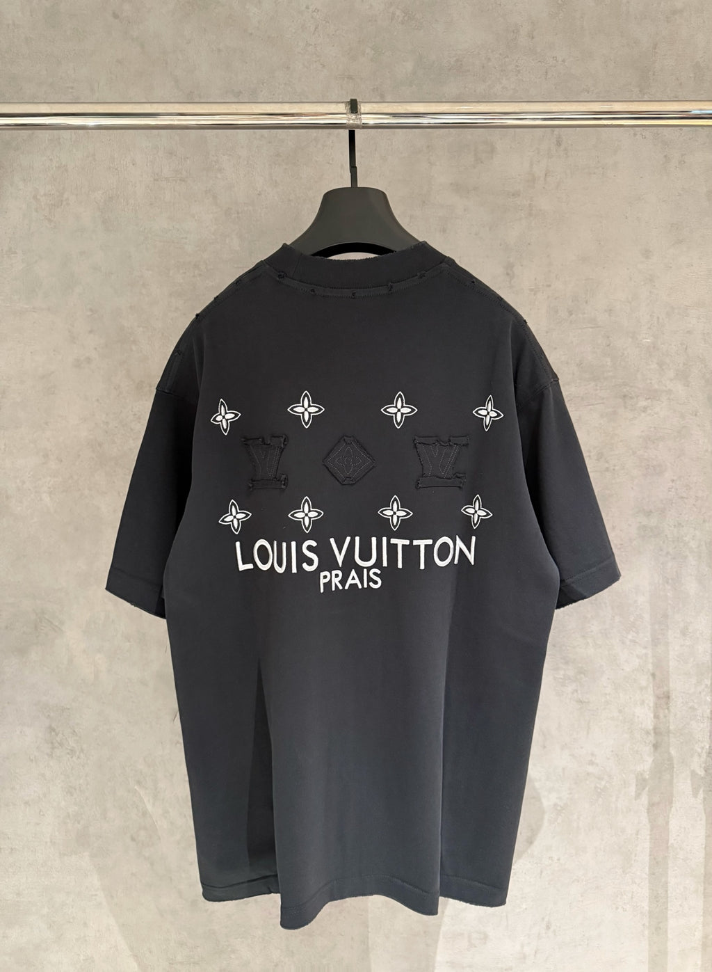 Louis Vuitton short-sleeve T-shirt, dark charcoal, back floral logo and “PRAIS” text