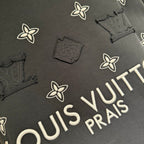 Louis Vuitton short-sleeve T-shirt detail, white floral print and “PRAIS” text