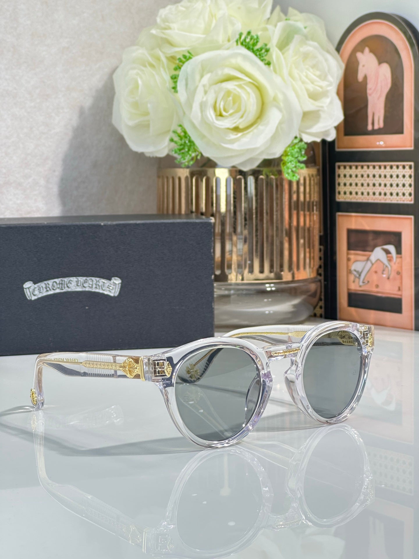 Chrome glasses with silver round frames and gray lenses