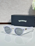 Chrome glasses with white round frames and gray-tinted lenses