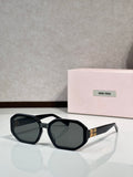 Square sunglasses, black frame with dark tinted lenses and Miu Miu logo on temple.