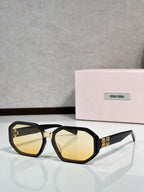 Square sunglasses with tortoise frame, amber-tinted lenses, and Miu Miu logo on temple.