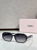 Square sunglasses with navy-dark tinted lenses and black frame, featuring Miu Miu logo.