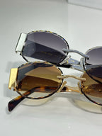 Celine sunglasses with mixed metal frames and dark tinted lenses