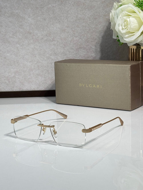 Metal eyeglass frames with clear lenses, gold-tone rectangular design