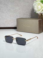Sunglasses with dark navy lenses, metal frame with gold-tone arms