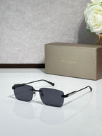 Sunglasses with dark lenses, metal frame with black and gold-tone arms