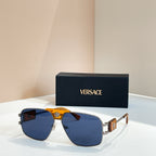 Versace sunglasses with blue lenses, gold frame, and amber center logo detail