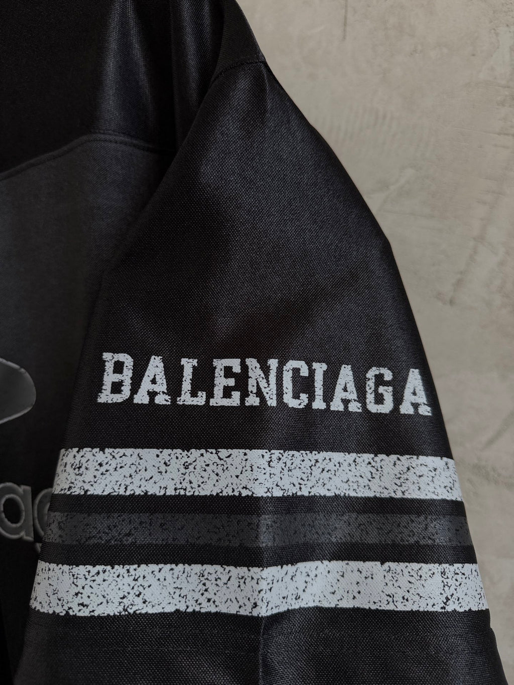 Balenciaga black polo sleeve with BALENCIAGA lettering and two-tone stripe band