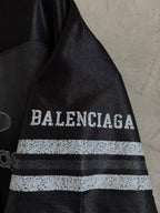 Balenciaga black polo sleeve with BALENCIAGA lettering and two-tone stripe band