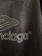 Black Balenciaga polo shirt with close-up logo print and crest detail