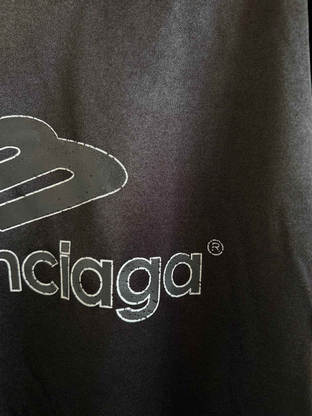 Balenciaga black polo back close-up with balenciaga logo lettering