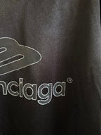 Balenciaga black polo back close-up with balenciaga logo lettering