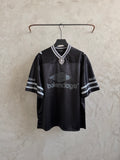 Balenciaga black polo shirt with striped collar and sleeve logo print