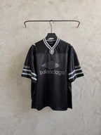 Balenciaga black polo shirt with striped collar and sleeve logo print