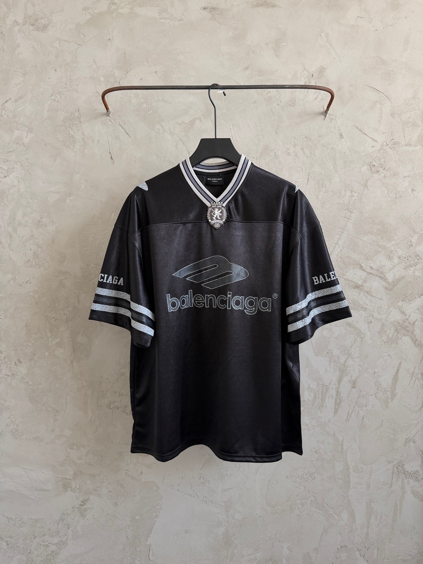 Balenciaga black polo shirt with striped collar and sleeve logo print